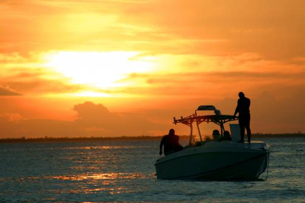 boat on water at sunset