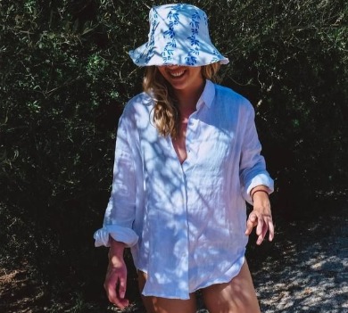 Woman wearing blue floral bucket hat | Sun-Surf Realty Emerald Isle NC Vacation Rentals