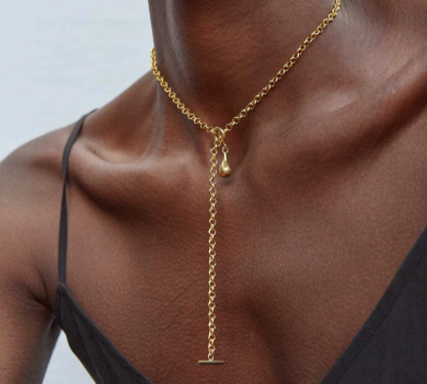 Woman wearing gold chain necklace | Sun-Surf Realty Emerald Isle NC Vacation Rentals