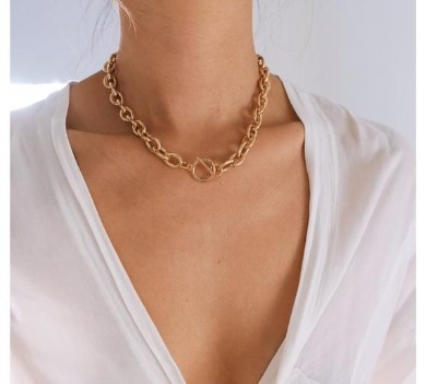 Woman wearing chunky gold chain necklace | Sun-Surf Realty Emerald Isle NC Vacation Rentals