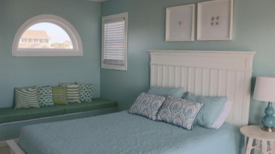 Coastal blues in the bedroom of the Emerald Isle beach house Sea Garden | Sun-Surf Realty Emerald Isle Real Estate