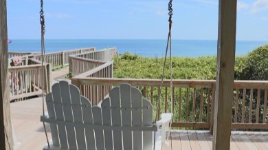 Oceanview swing on the deck of the Emerald Isle beach house Great Expectations | Sun-Surf Realty Emerald Isle Real Estate