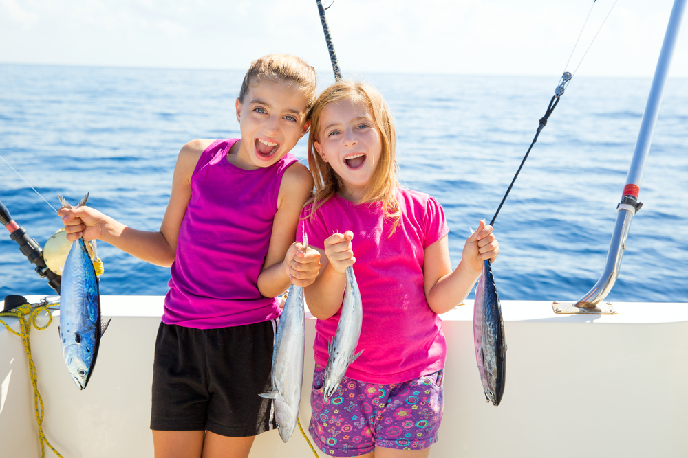 Two girls out on one of the local Emerald Isle fishing charters.