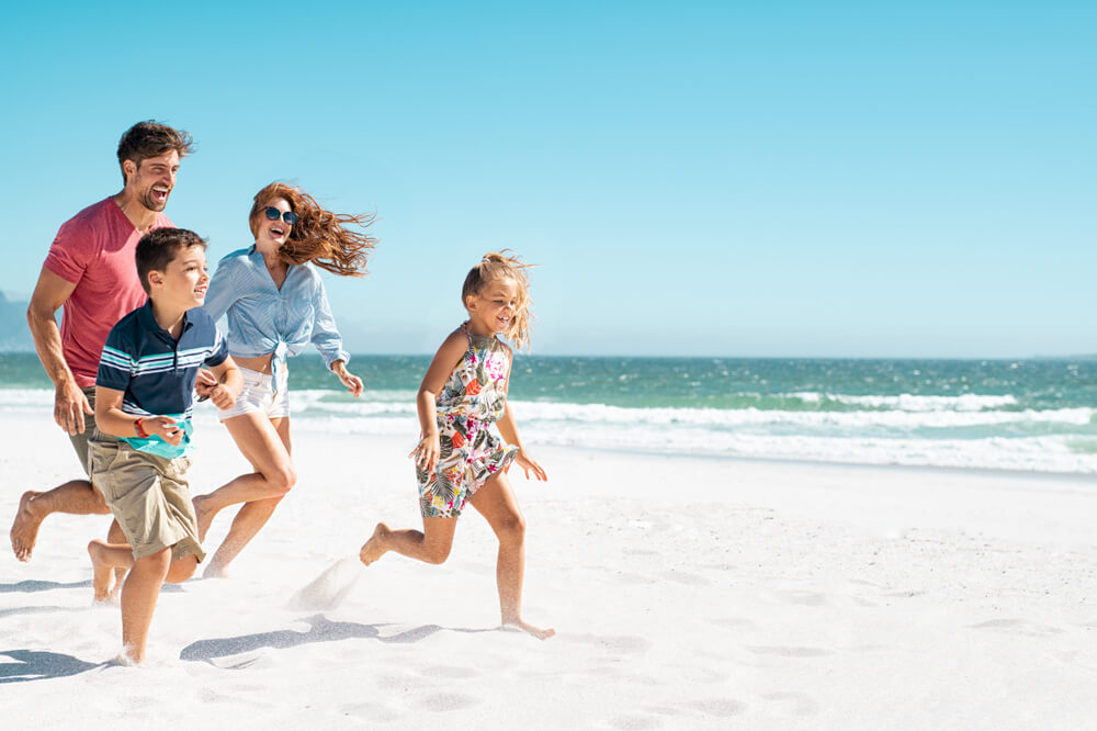 A family on the beach, one of the things to do in Emerald Isle, North Carolina.