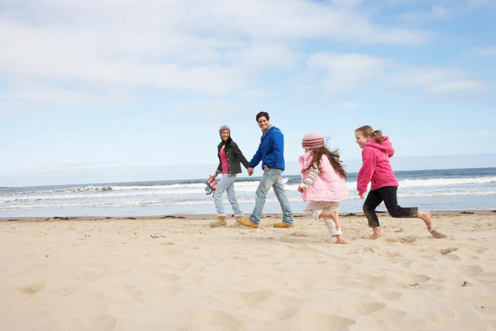 A family on the beach in Emerald Isle, North Carolina, in the winter.